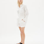 Classic white cotton shirt styled casually, showing versatile everyday wea
