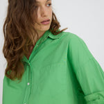 Light verde green cotton button-up shirt with relaxed fit and drop shoulders