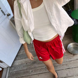 Classic white cotton shirt styled casually, showing versatile everyday wear