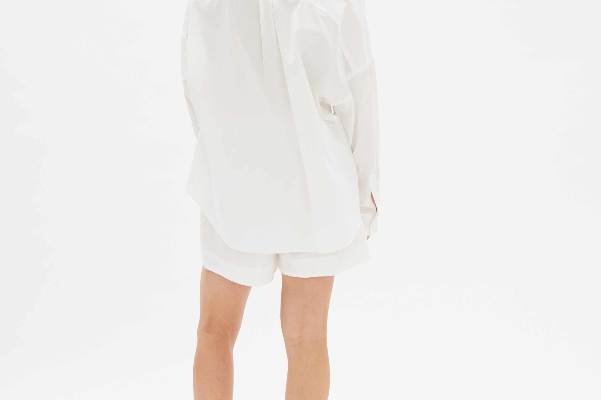 White long sleeve shirt made from 100% organic cotton with relaxed fit and custom buttons