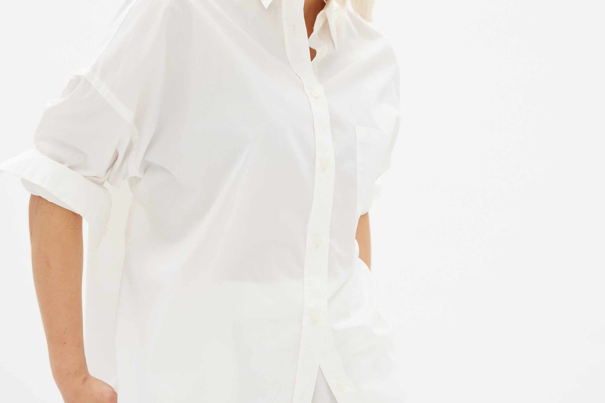 White long sleeve shirt made from 100% organic cotton with custom buttons and relaxed fit