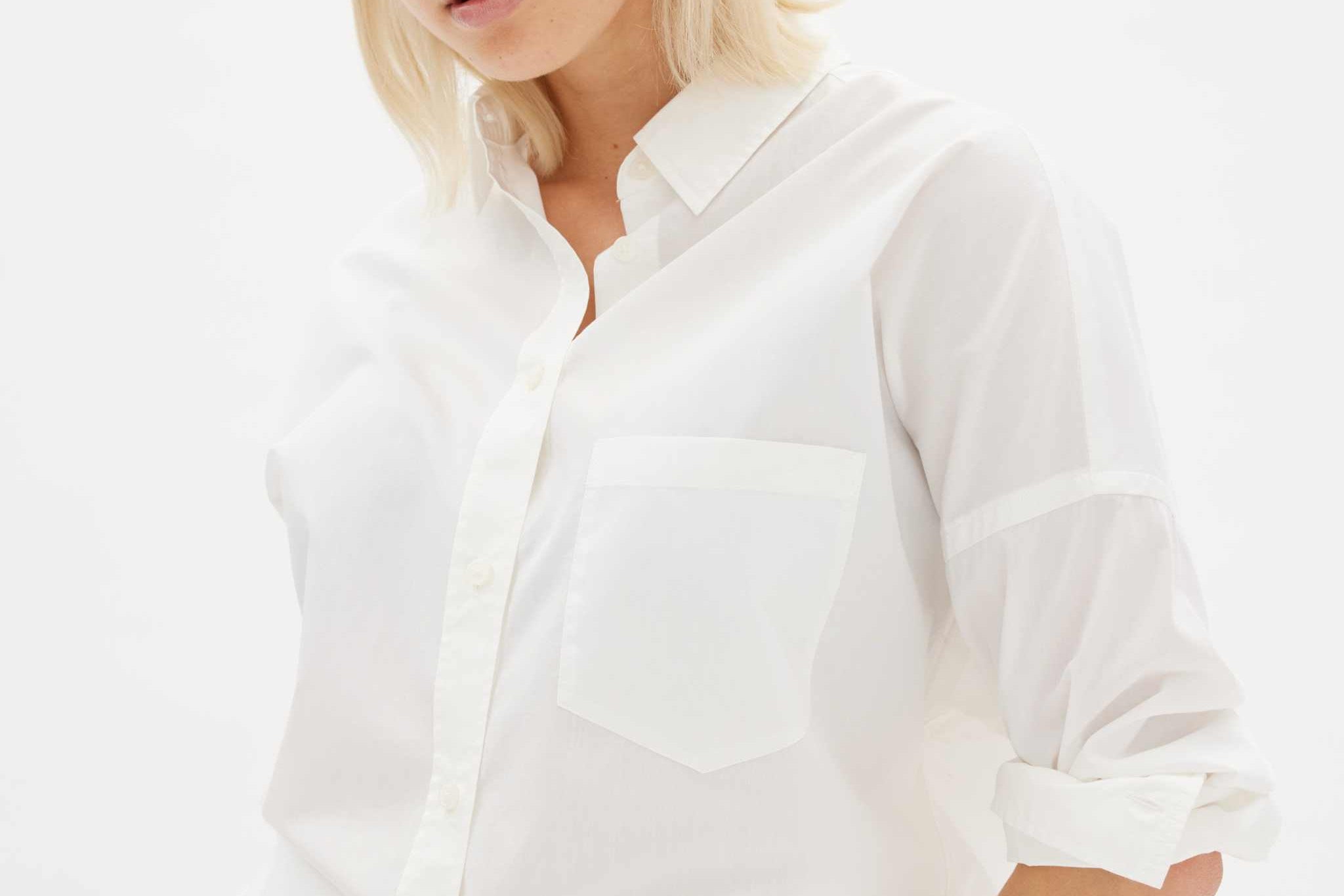 White long sleeve shirt made from 100% organic cotton with custom buttons and relaxed fit