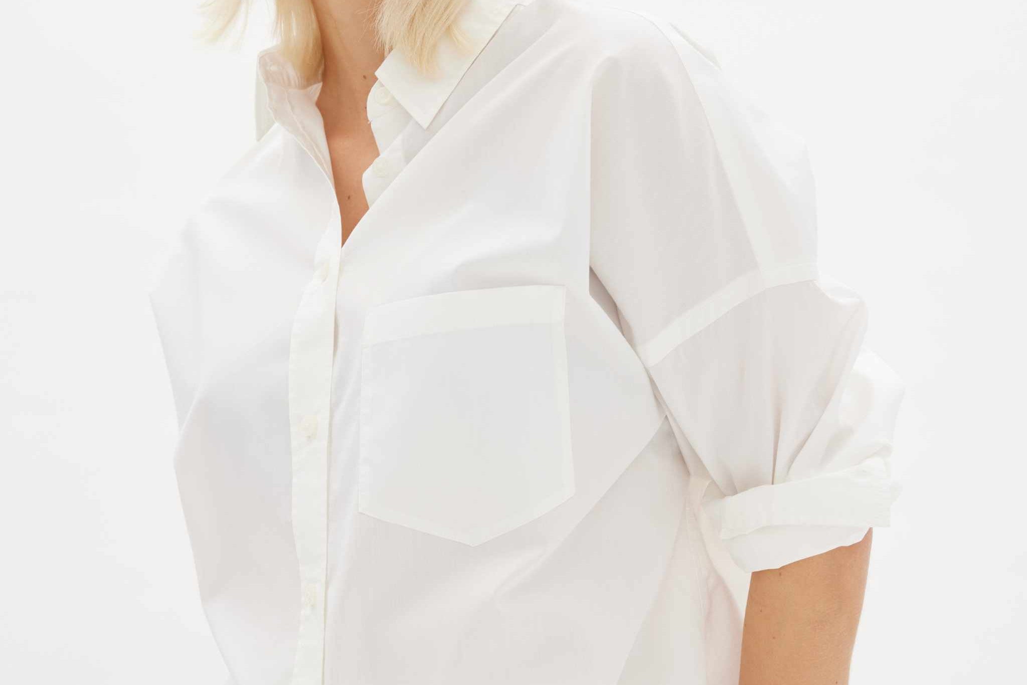White long sleeve shirt made from 100% organic cotton with relaxed fit and custom buttons