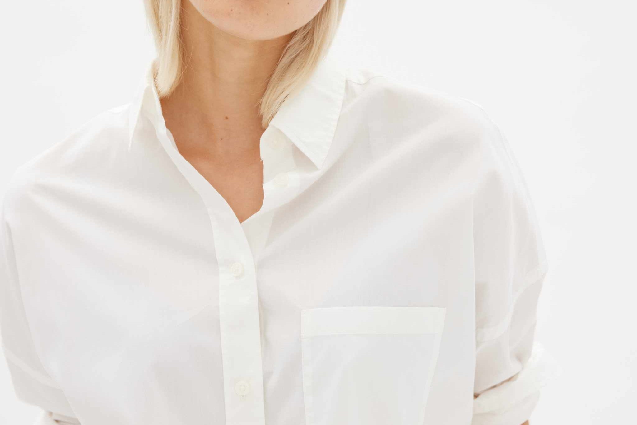 White long sleeve shirt made from 100% organic cotton with a relaxed fit and custom-dyed buttons