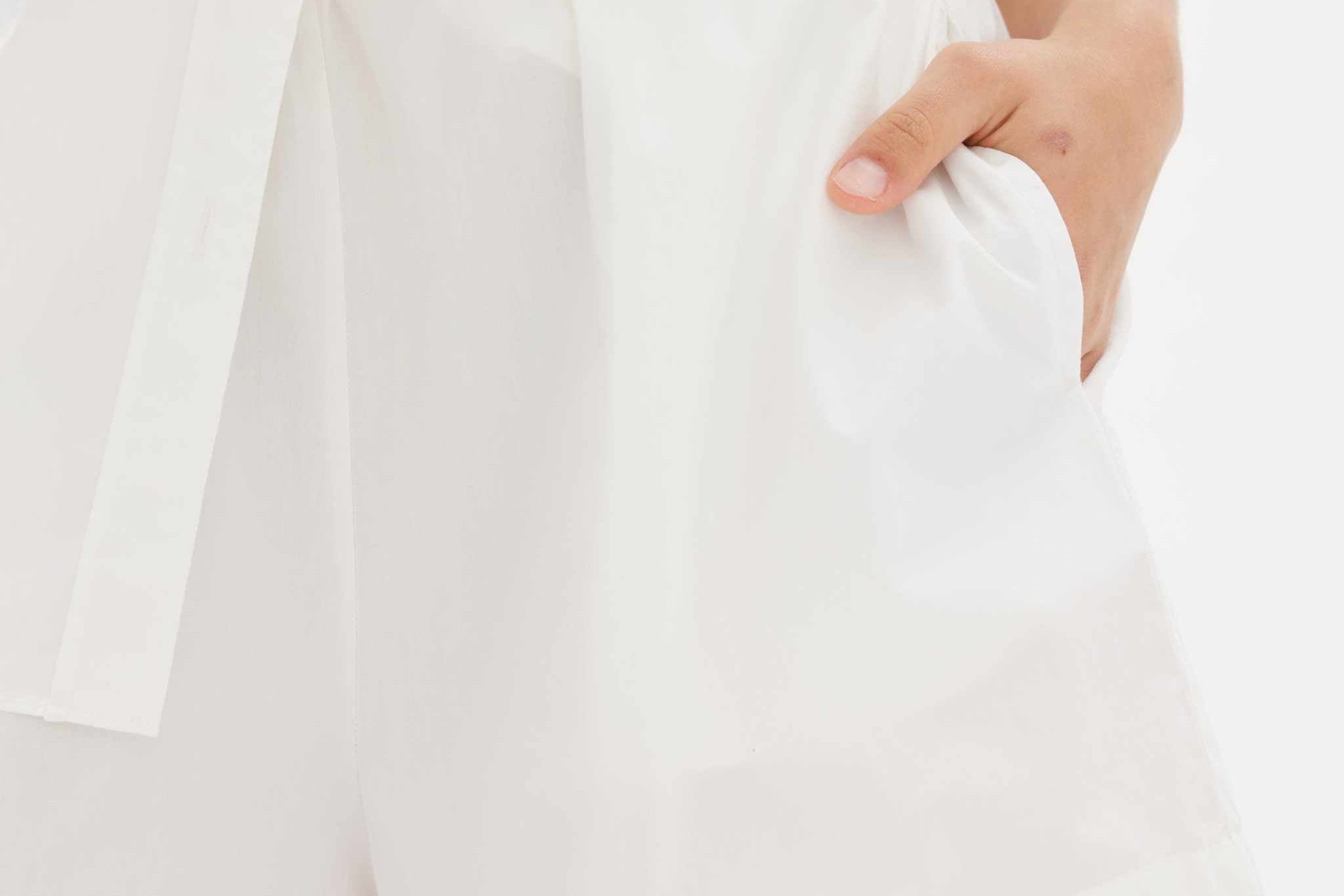 White long sleeve shirt made from 100% organic cotton with relaxed fit and custom buttons