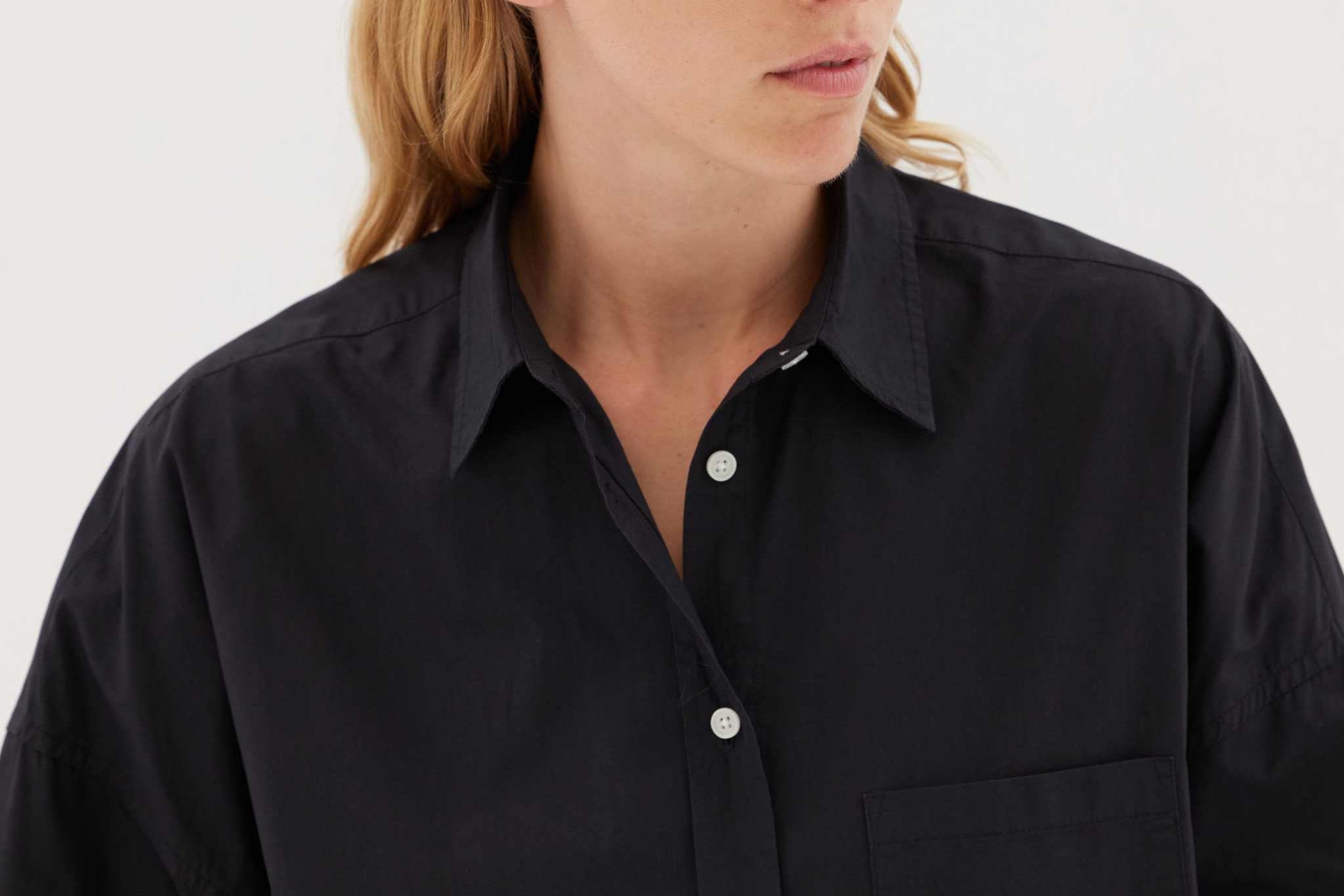 Black Chiara signature classic button-up shirt with chest pocket and relaxed fit on model