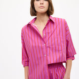 Chiara oversized striped shirt in fuchsia, true red, and natural with drop shoulders and chest pocket