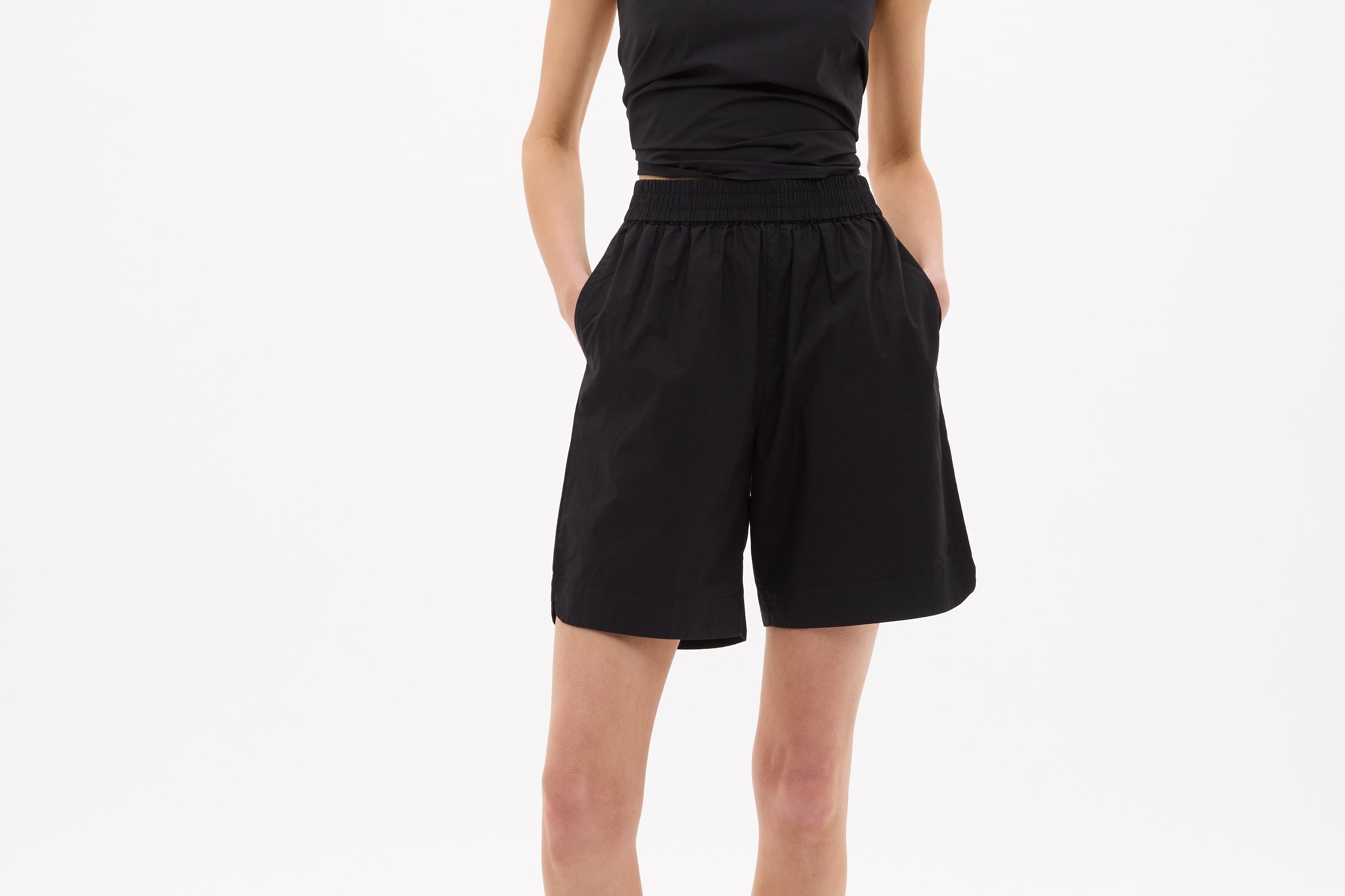 Black mid length cotton shorts with elastic waistband and side pockets