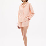 Model wearing Chiara Long Sleeve Cotton Shirt with custom yarn-dyed stripes and relaxed fit at Spanish Villa