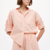 Model wearing Chiara Long Sleeve Cotton Shirt in Spanish Villa with custom stripe and drop shoulders