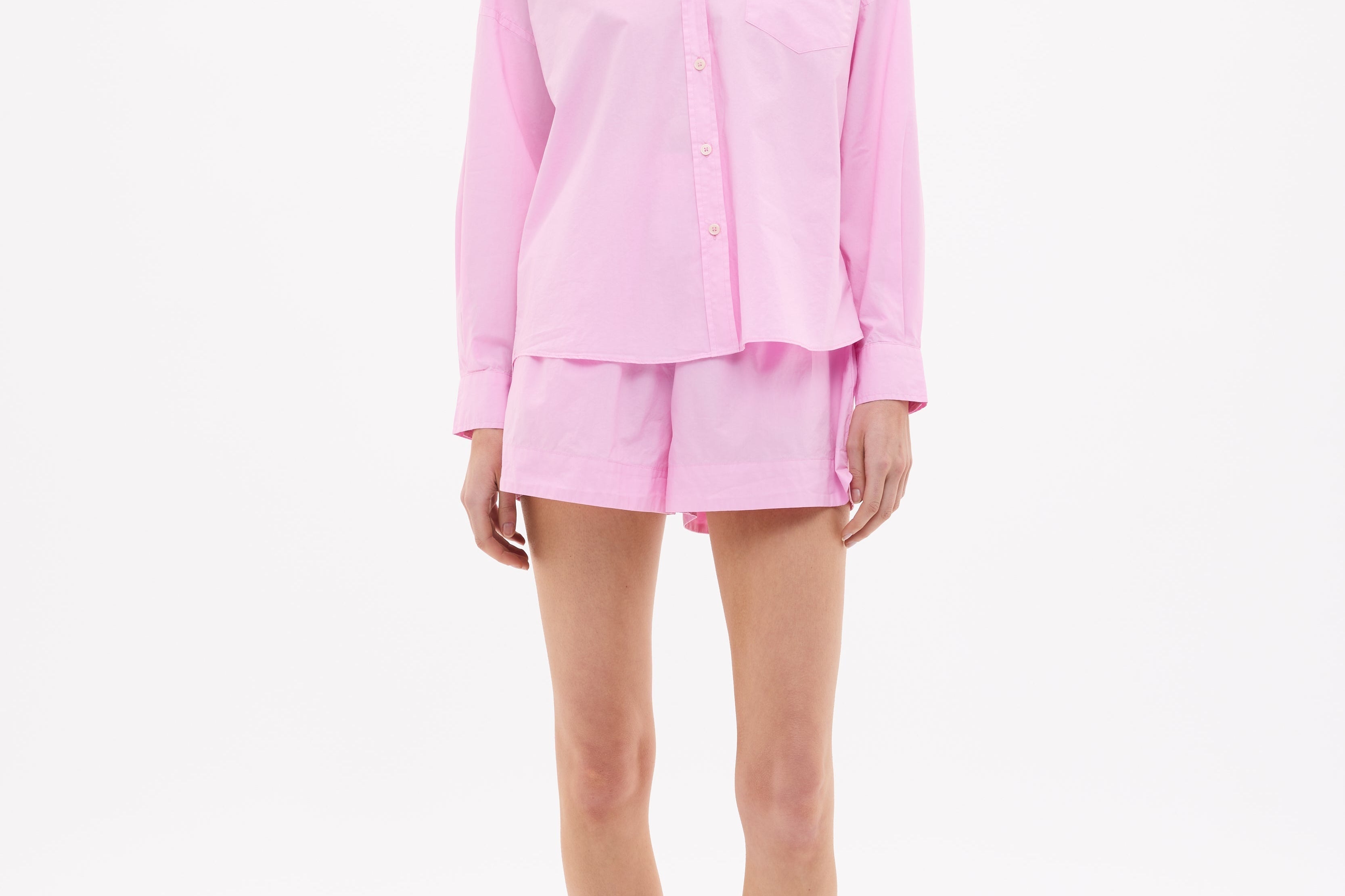 Women wearing Rose Glow oversized cotton button-up shirt with chest pocket and drop shoulders