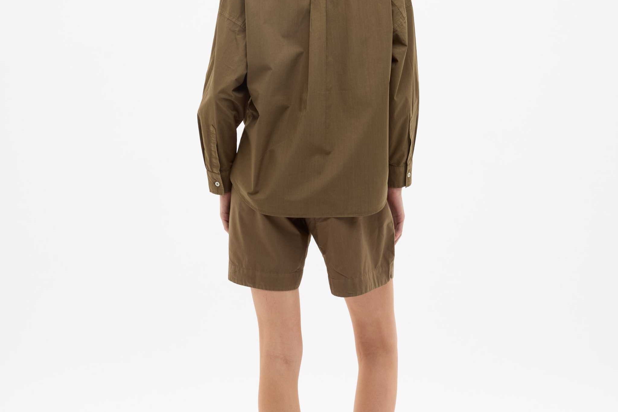 Dark olive Classic Long Sleeve Shirt with custom stripes, relaxed fit, chest pocket, and drop shoulders, made from 100% cotton.