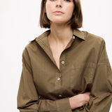 Dark olive Classic Long Sleeve Shirt with custom stripe, chest pocket, drop shoulders, and relaxed fit made from 100% cotton.