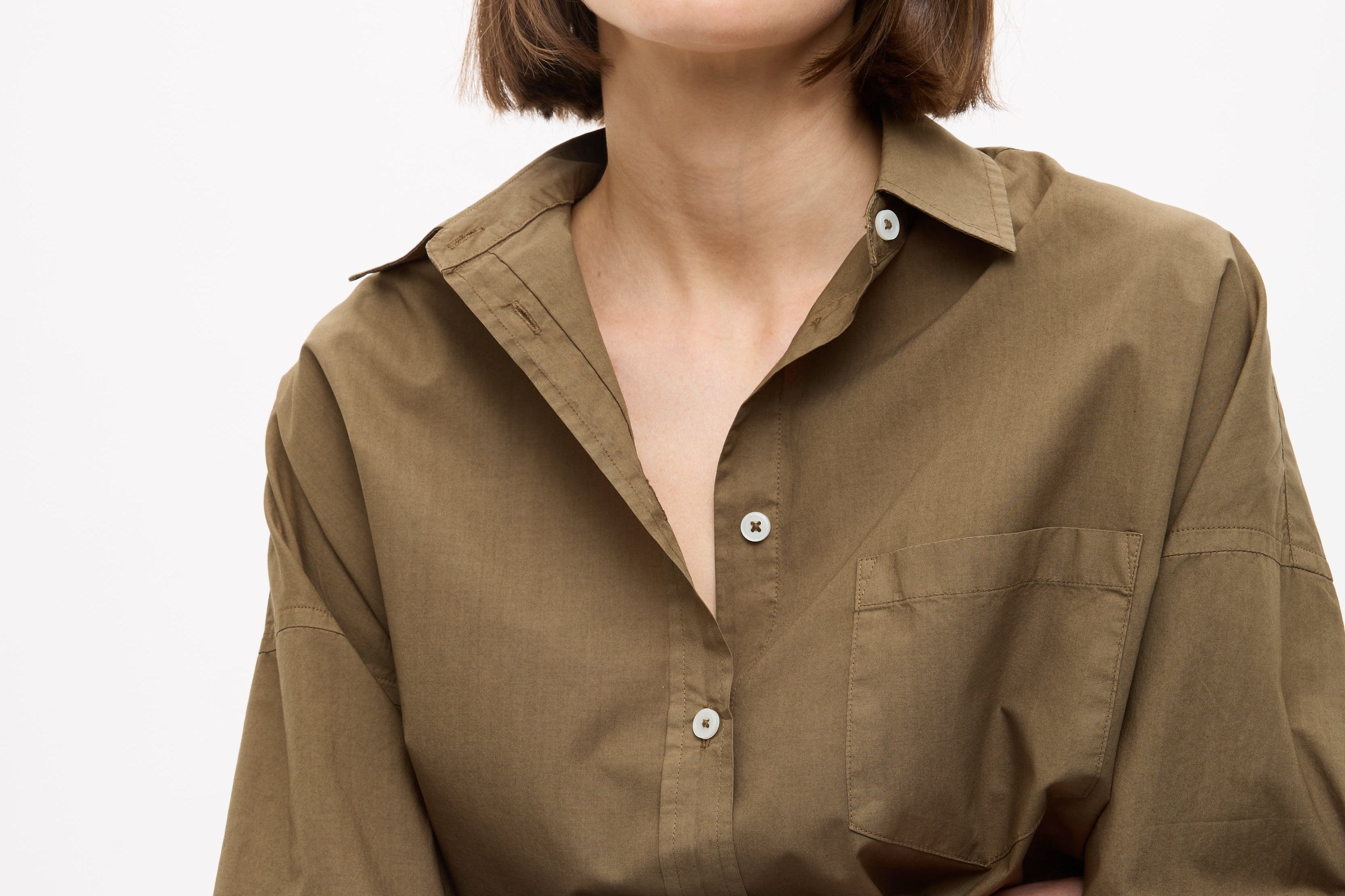 Dark olive Classic Long Sleeve Shirt with custom stripe, chest pocket, drop shoulders, and relaxed fit made from 100% cotton.