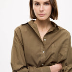 Dark olive Classic Long Sleeve Shirt with chest pocket and relaxed fit on model