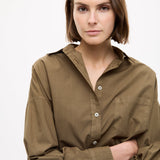 Dark olive Classic Long Sleeve Shirt with chest pocket and relaxed fit on model