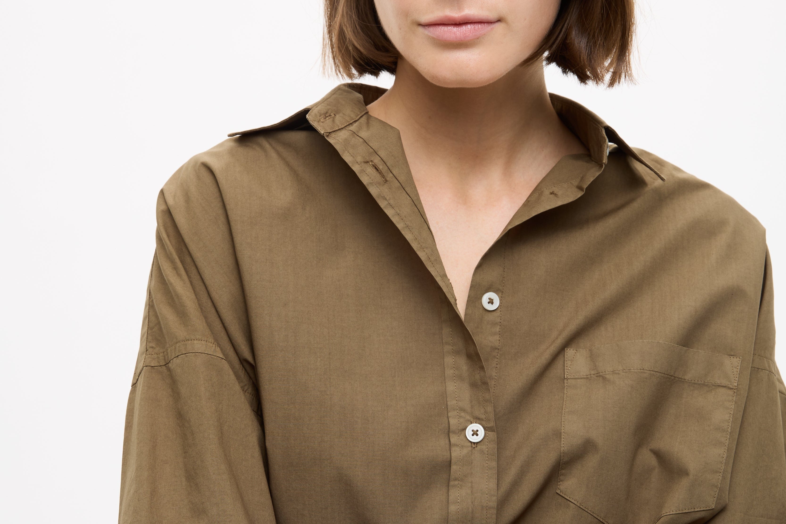 Dark olive Classic Long Sleeve Shirt with chest pocket and relaxed fit on model