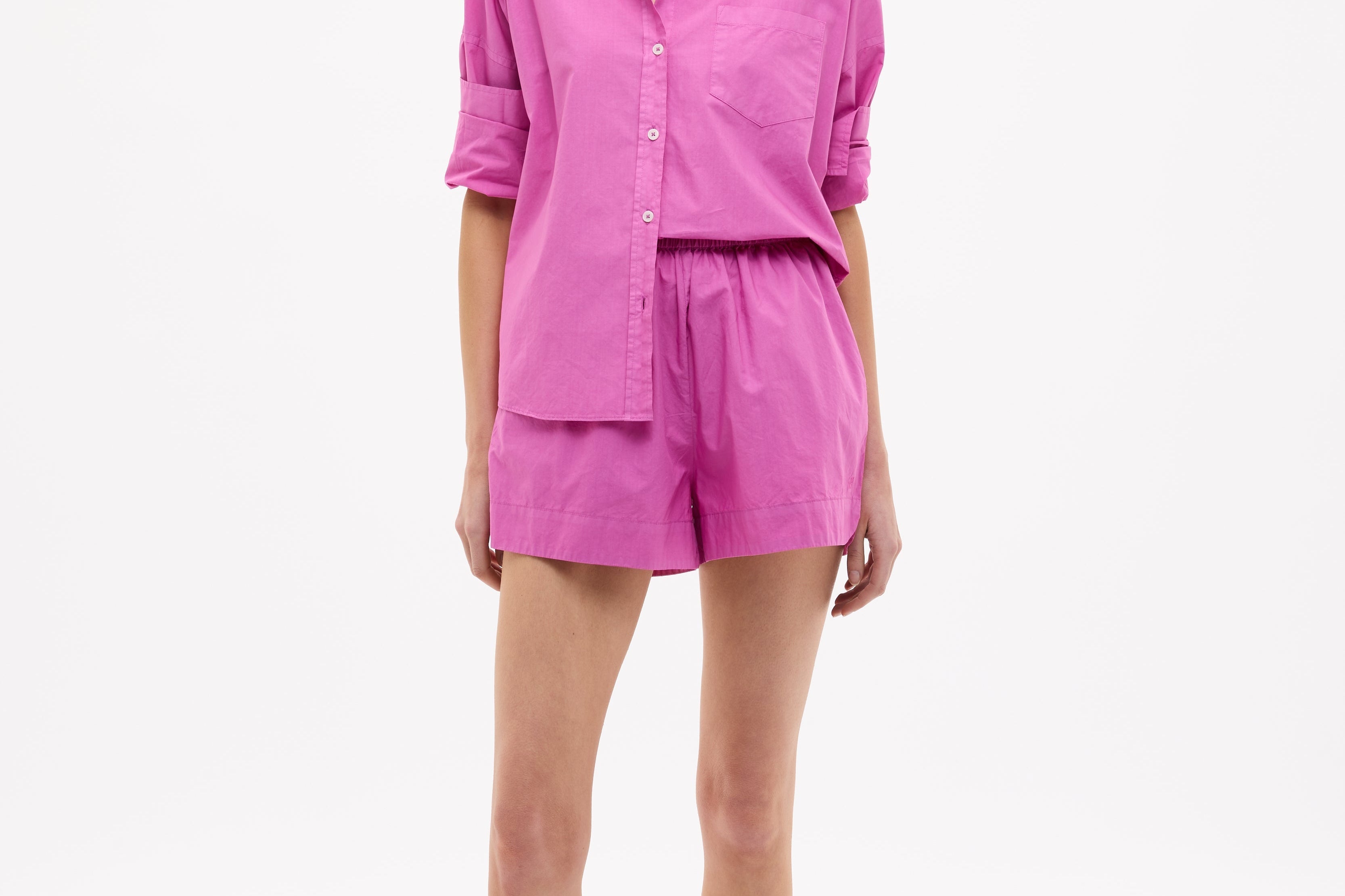 Chiara Cotton Long Sleeve Shirt in fuchsia with classic button-up, chest pocket, drop shoulders, and relaxed fit