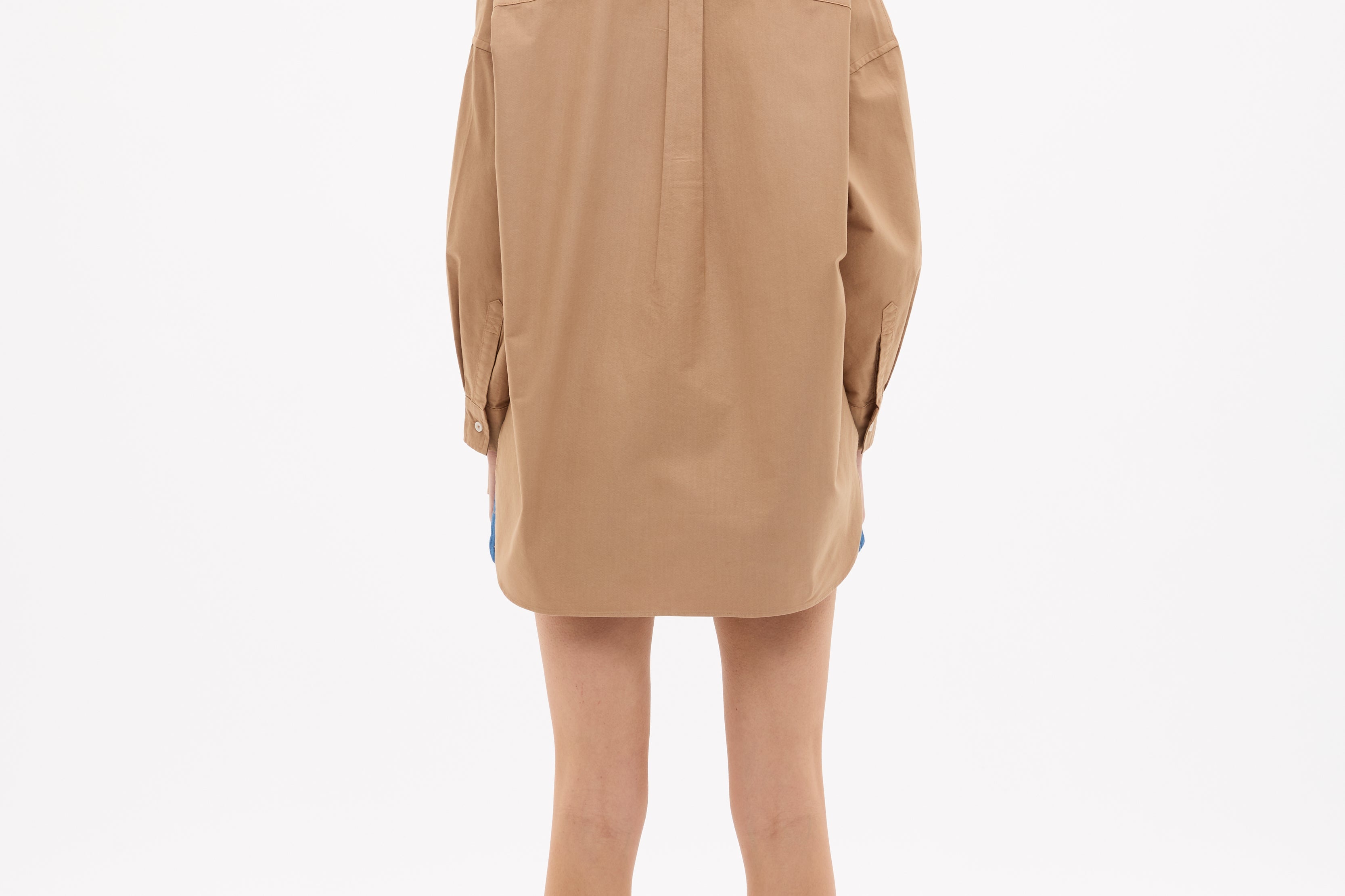 Woman seen from behind wearing a Mara Oversized Long Sleeve Shirt - Toffee with relaxed fit and long cuffs