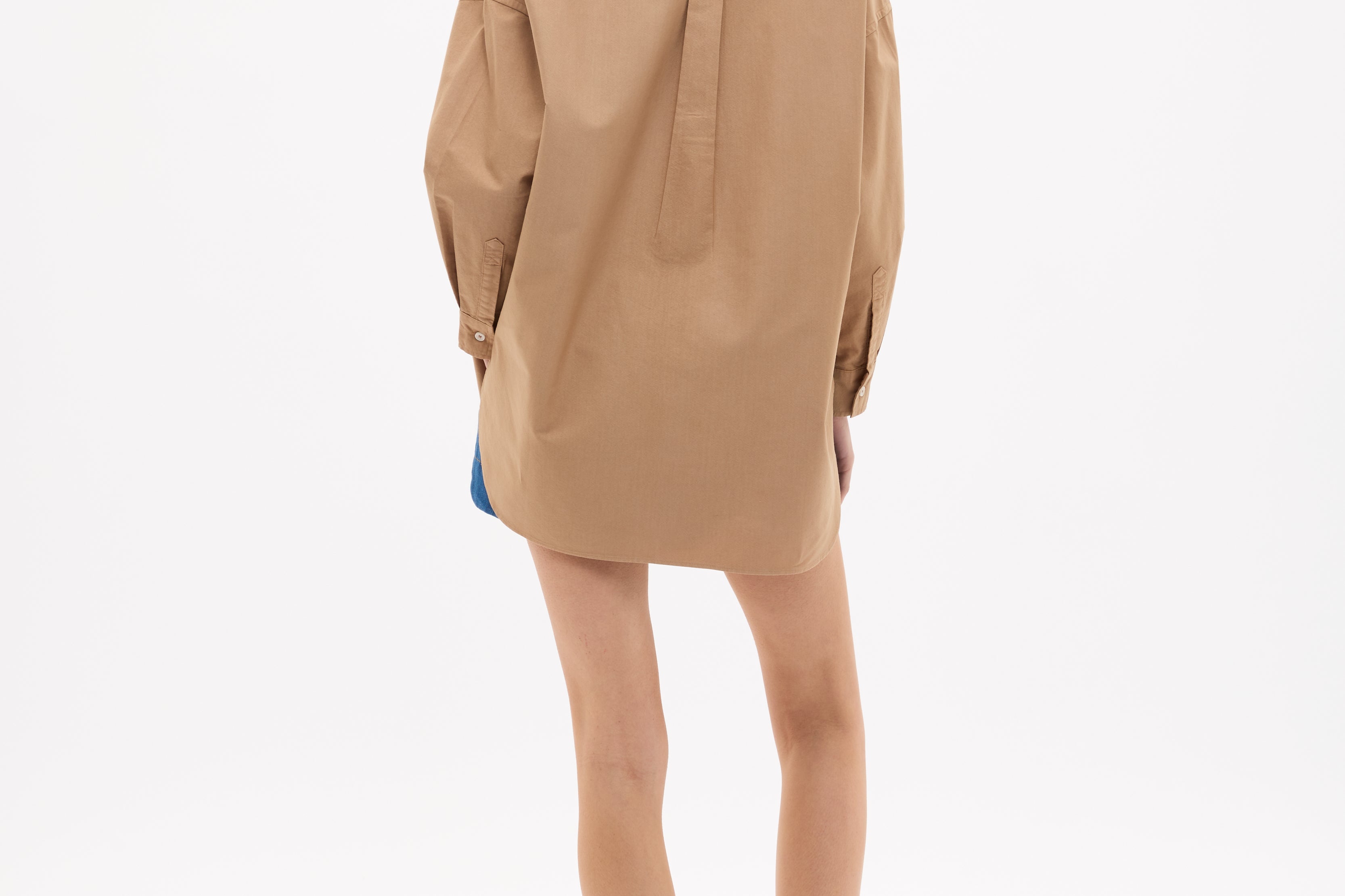 Woman wearing Mara Oversized Long Sleeve Shirt - Toffee in a relaxed fit, shown from behind on a white background.