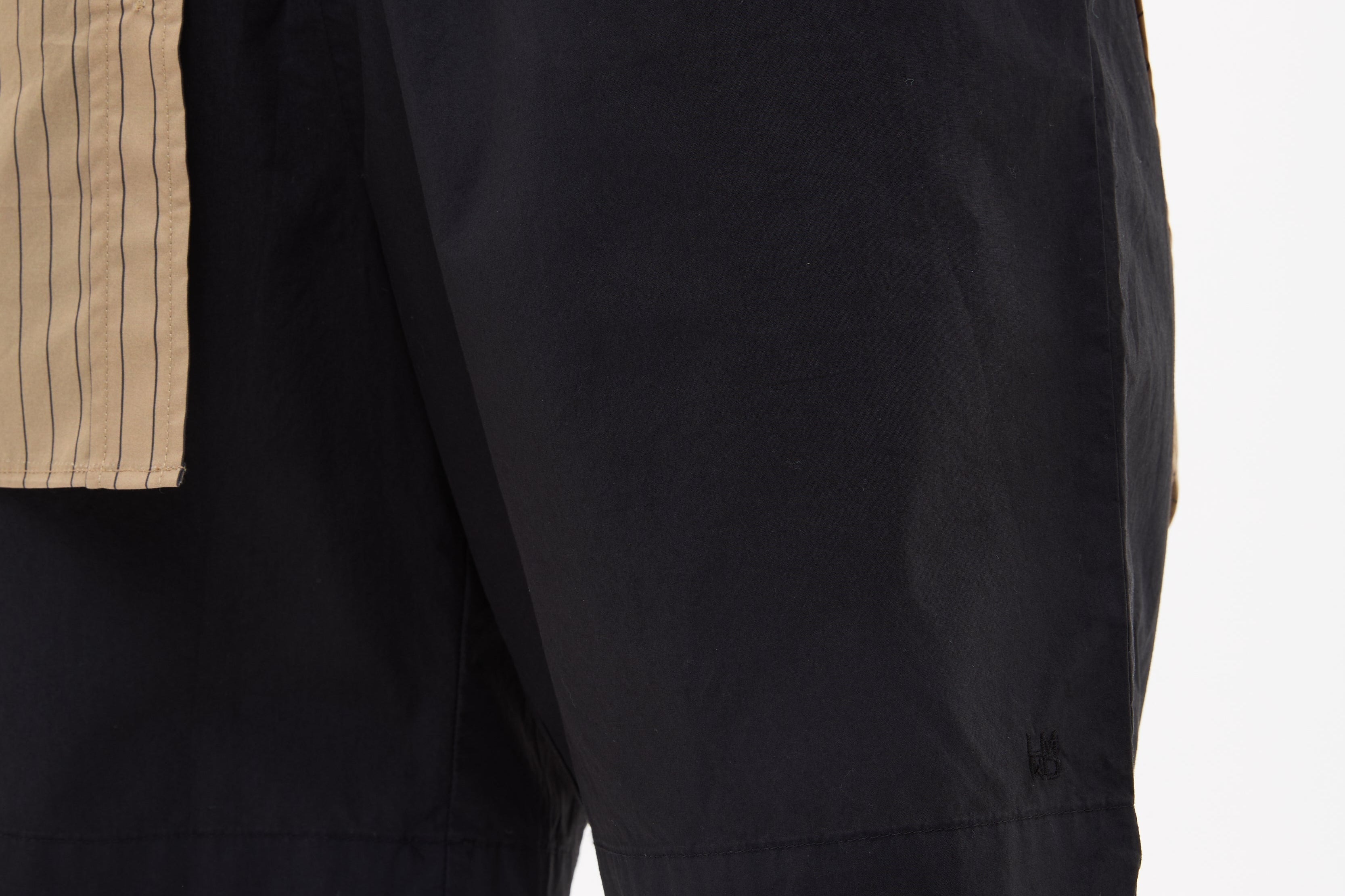 Black mid length cotton shorts with relaxed fit and elastic waistband