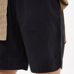 Black mid length cotton shorts with elastic waistband and side pockets