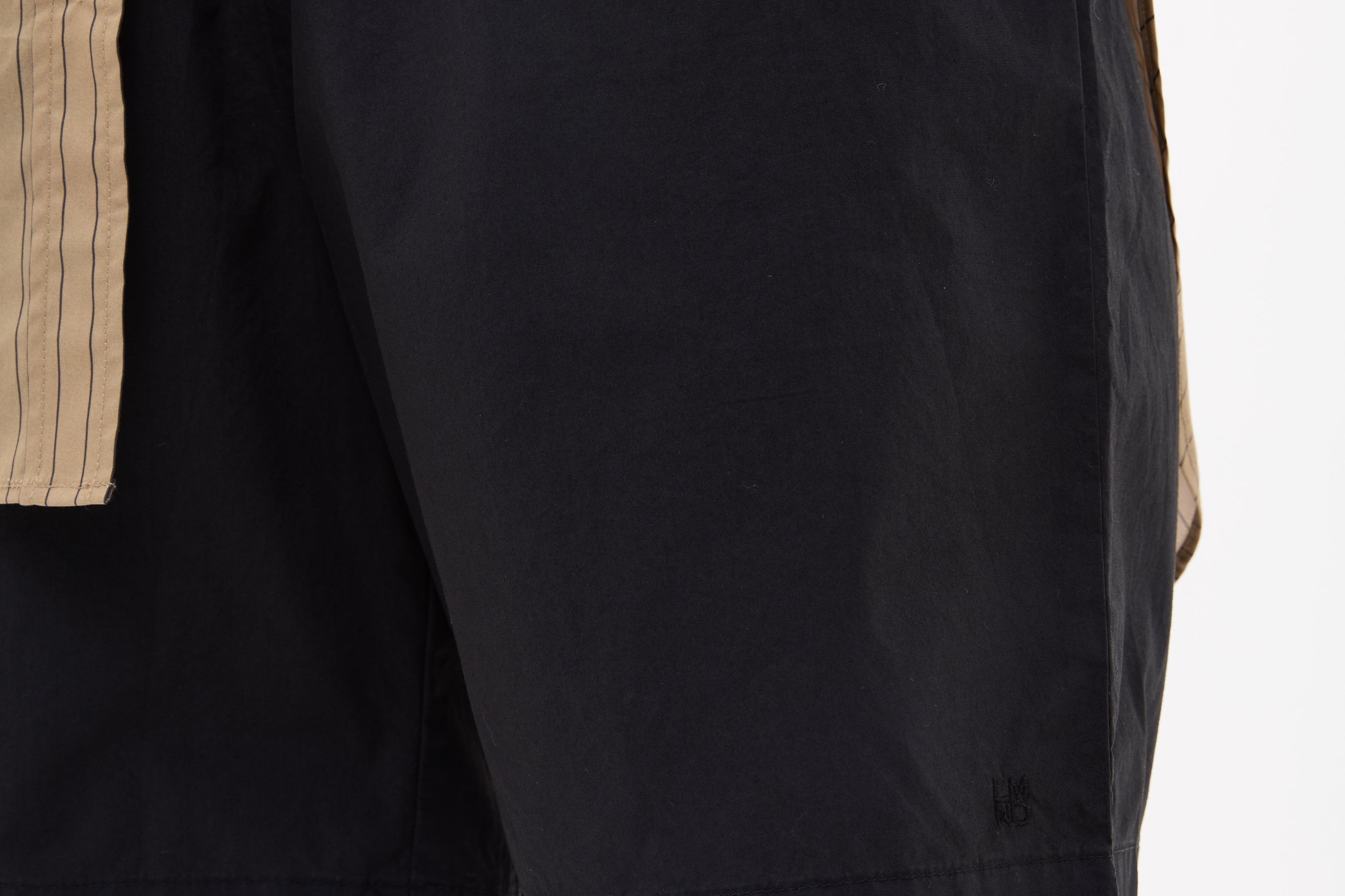 Black mid length cotton shorts with elastic waistband and side pockets