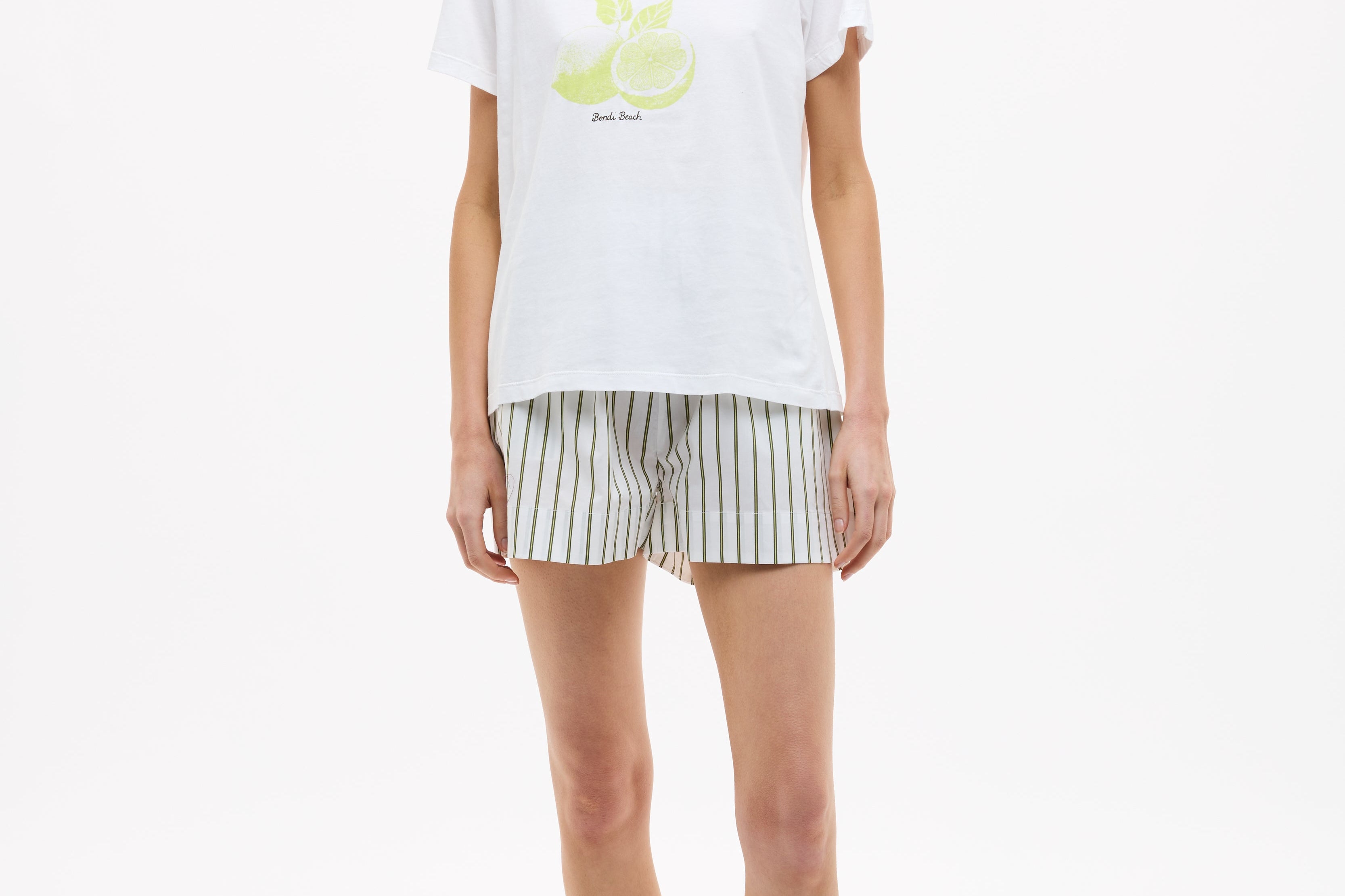 White LMND Tee for women with relaxed fit cotton and LIMONADA print in dark olive and sunny lime