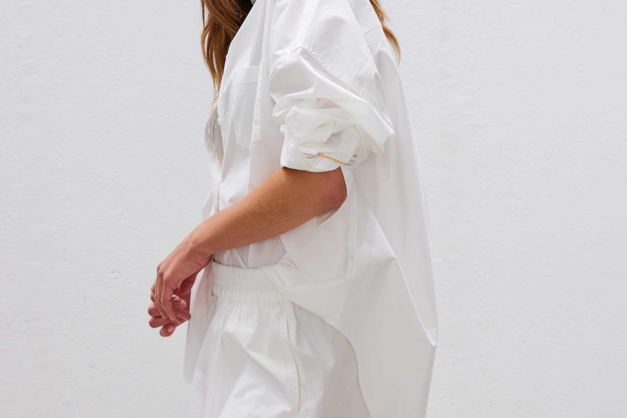  Classic white cotton shirt styled casually, showing versatile everyday wear