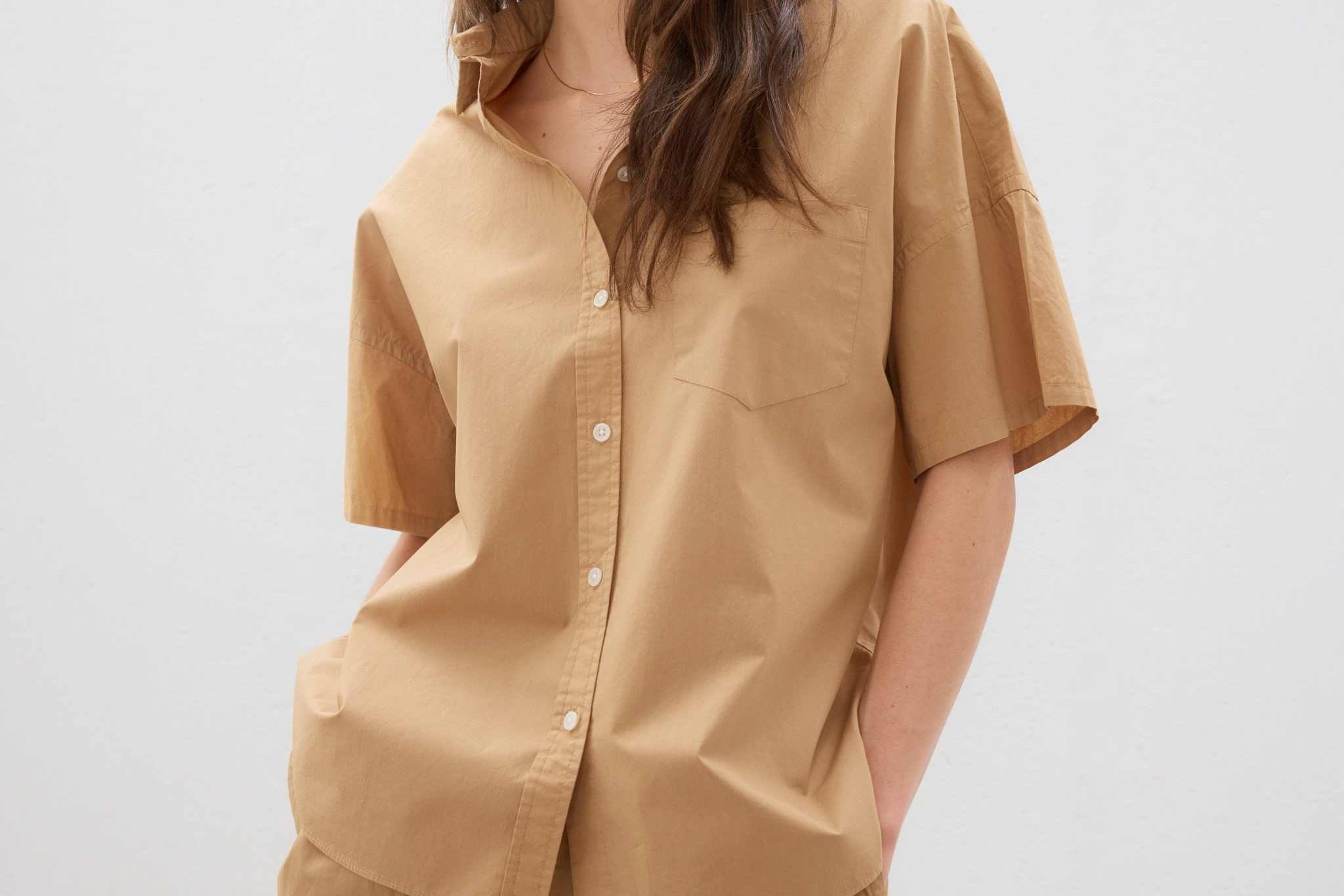 Woman's cotton button-up short sleeve shirt in toffee with relaxed fit and chest pocket.